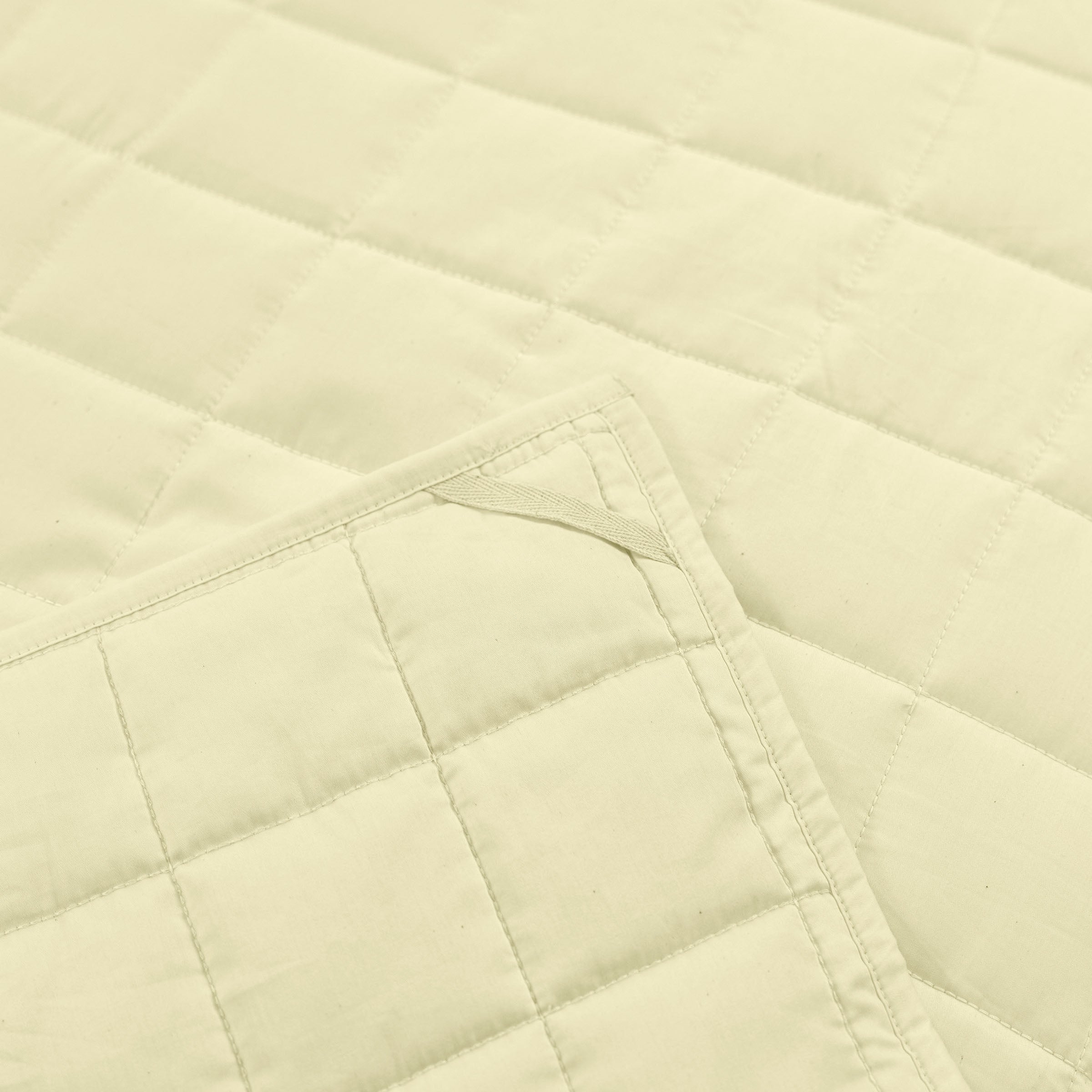 organic-cotton-quilt-in-butter-colour-corner-loop-detail-by-sojao